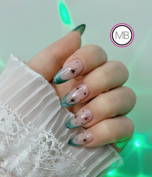 Holiday teal glitter nail art with starburst design on almond nails by ManiBliss nail salon Duluth GA