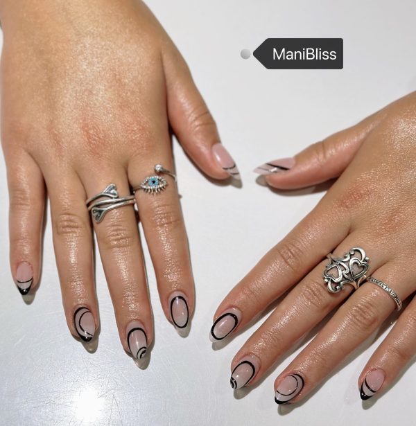 Minimalist black line art French tip on nude almond nails by ManiBliss Organic Nails and Spa Duluth GA